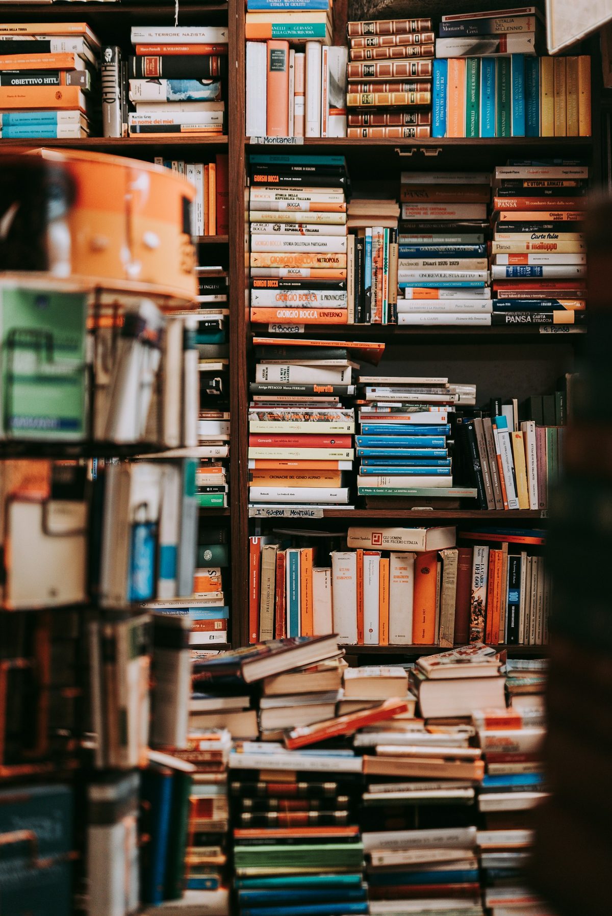For Book City in the Beach: Stacks and shelves of books in a crowded bookshop (portrait).