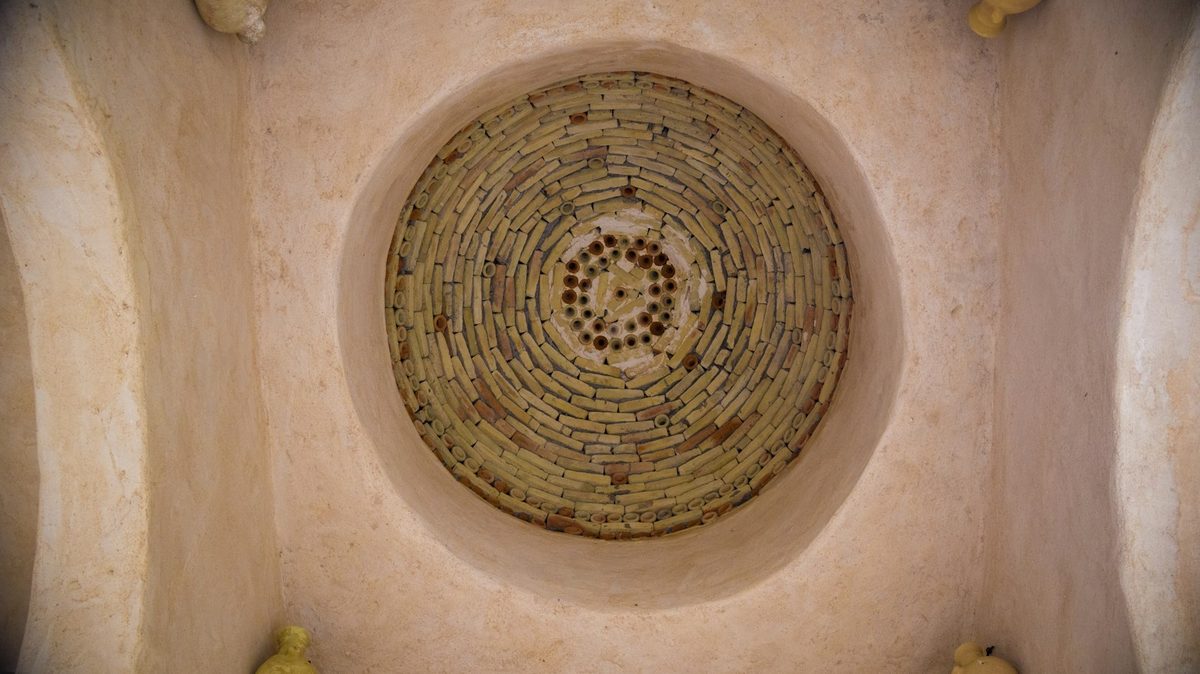 For Hammam Spa by Céla: Looking up into a pale plaster hammam dome dotted with small round skylights