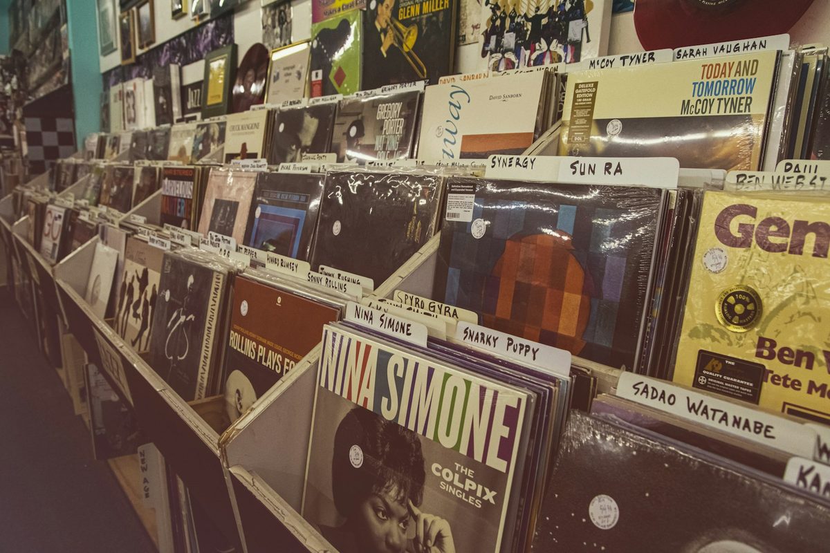For Rotate This: Racks of jazz LPs in a record shop, sleeves facing out.